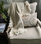 Cotton throw blanket on sofa